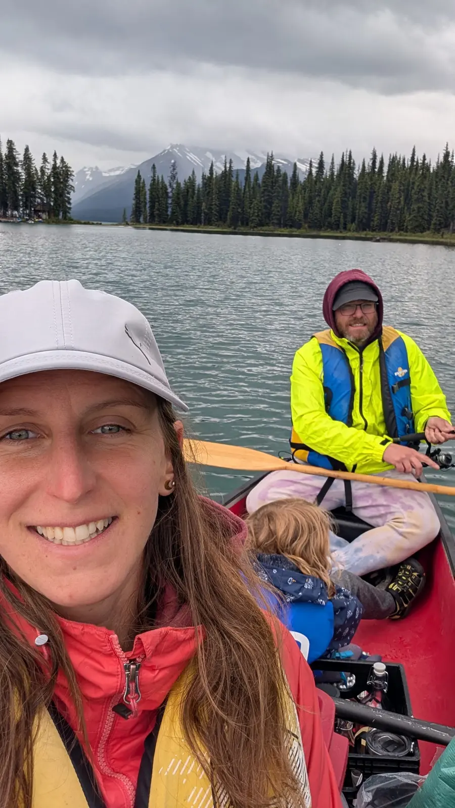 The TreeBeaver family canoeing on a mountain lake